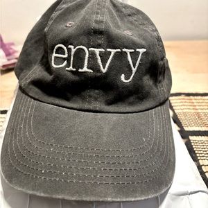 Envy Cap Smoked  grey with white snapped back closure.